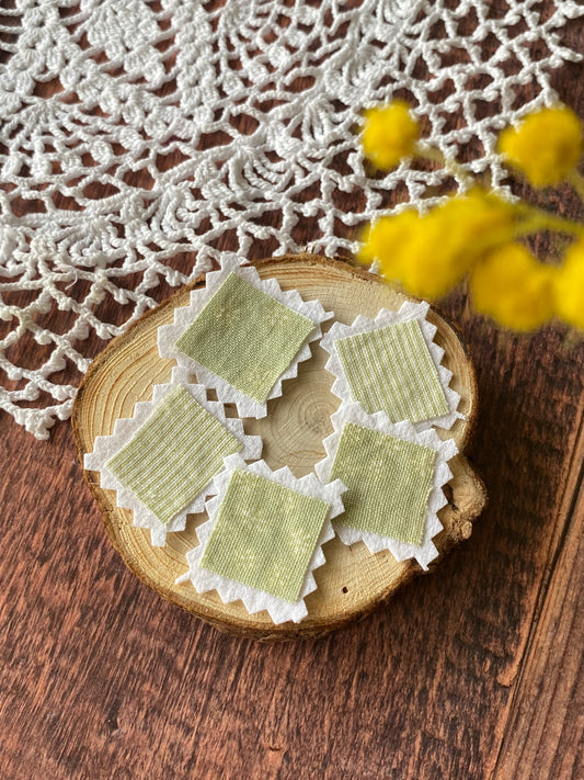 Faux timbre en tissus vert